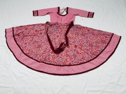 Pink Anarkali Dress with light green and dark red patterns.